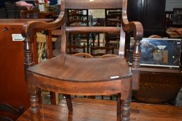 A 19th Century mahogany carver chair having shaped seat on turned frame