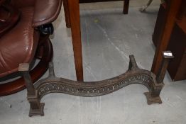 A vintage cast serpentine fire front or fender