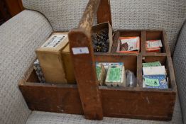 A vintage wooden parts trug and contents