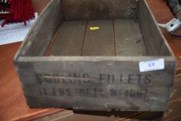 A vintage wooden food crate, stamped codling fillets