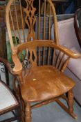 A vintage Windsor style rocking chair, beech or rubberwood