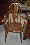 A traditional wheelback carver chair