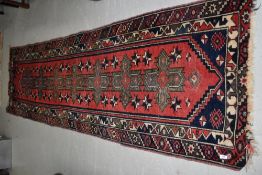 A Persian carpet runner , approx. 277 x 77cm, ends bit frayed