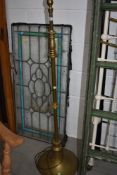 A vintage brass standard lamp