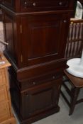 A pair of modern mahogany bedside cabinets