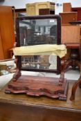 A Victorian mahogany toilet mirror, on shaped base, width approx. 55cm
