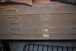 A vintage plan chest of five drawers on stand