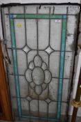 A pane of leaded and coloured glass , approx. 103 x 50cm