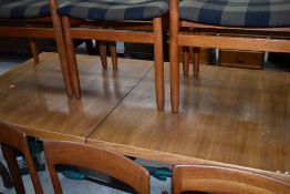 A nice quality vintage teak extending dining table and six (four plus two) chairs, Scandinavian