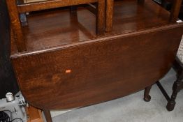 An early to mid 20th Century gateleg dining table, width approx. 110cm