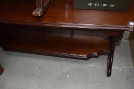 A modern Rossmore coffee table in a red stained wood