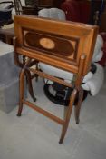 An Edwardian mahogany and inlaid folding desk or work table on stand