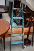 A set of vintage wooden step ladders
