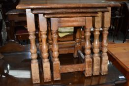 A vintage oak nest of three tables, splay leg design, in need of a tidy up