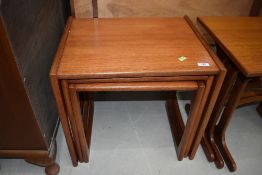 A vintage G plan style teak nest of three tables