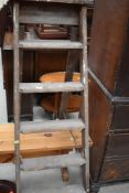 A set of vintage wooden step ladders
