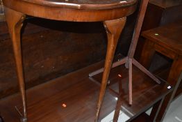 A demi lune hall side table with mahogany veneer