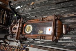 A late 19th or early 20th Century mahogany cased Vienna wall clock