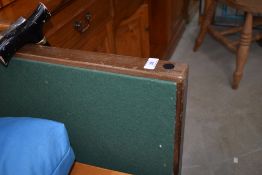 A traditional folding card table and two walking sticks