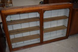 A part Victorian stained frame shallow wall display, width approx. 130cm