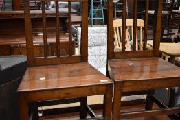 A pair of period oak solid seat dining chairs, in restored condition