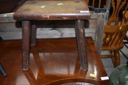 A traditional four legged milking style stool