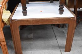 A vintage square coffee table