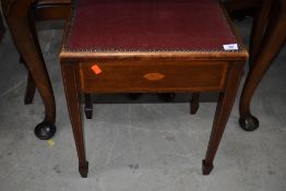 An Edwardian mahogany and inlaid piano stool