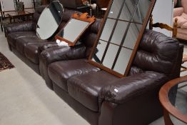 Two modern brown leatherette three and two seater settees
