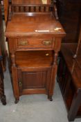A Victorian mahogany pot cupboard, in the Aesthetic style, labelled Starkey and Meild ,