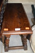 An early to mid 20th Century oak drop leaf occasional table, on twist frame, open dimensions approx.