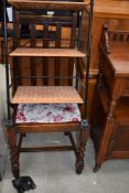 A mid 20th century rail back dining chair and a modern storage rack