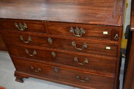A Georgian style mahogany bureau having later handles , with fitted part inlaid interior