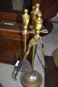A brass companion stand