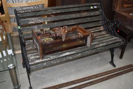 A vintage garden bench having cast ends, slats could do with a bit of renovation