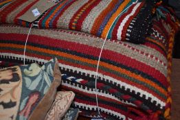 A selection of tribal style floor cushions etc