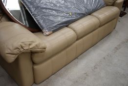 A vintage light brown leather three seater settee, possibly G plan