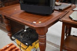 A restored mahogany Victorian wind out table with additional leaf