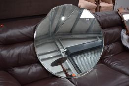 A large vintage frameless mirror, diameter approx. 91cm