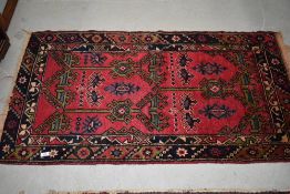 A Persian style fireside rug, approx. 140 x 76cm