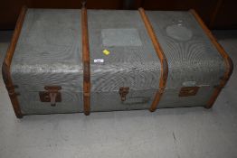 A vintage travel trunk , woodbound