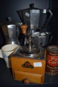 Three hob top coffee peculators, a grinder and a vintage coffee tin and Horlicks mug.