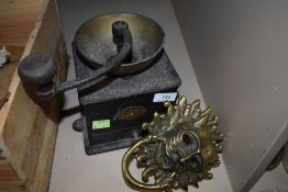 A large cast Victorian coffee grinder and a large brass door knocker