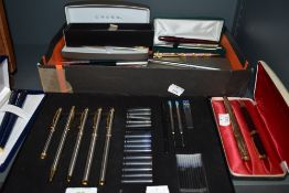 An assortment of fountain pens,biros,pencils and cartridges, a lot with boxes, includes Parker and