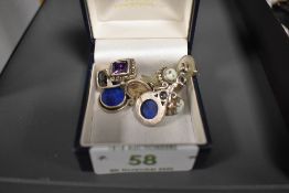 A framed watercolour of Paris and a similar print, also included is a framed painting on fabric '