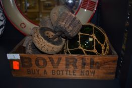A vintage wooden Bovril box,a glass float and an assortment of cork fishing net floats.