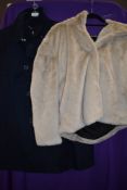 A vintage beige lambskin coat,medium size.