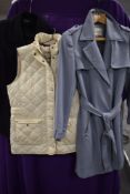 A ladies blue belted coat by George collection size 10, a Regatta body warmer size 12 and a double