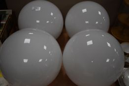 A set of four vintage milk glass globular light shades