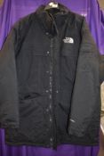 A gents North face coat in black, size XXL.